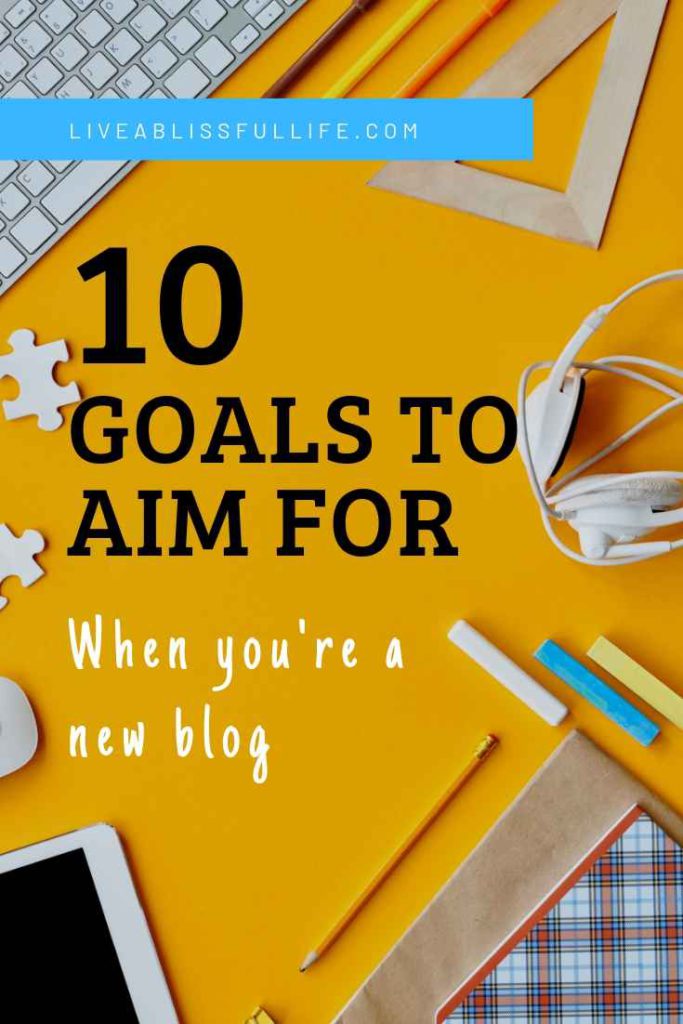 image: yellow table with keyboard and other office supplies
text: 10 goals to aim for when you're a new blog